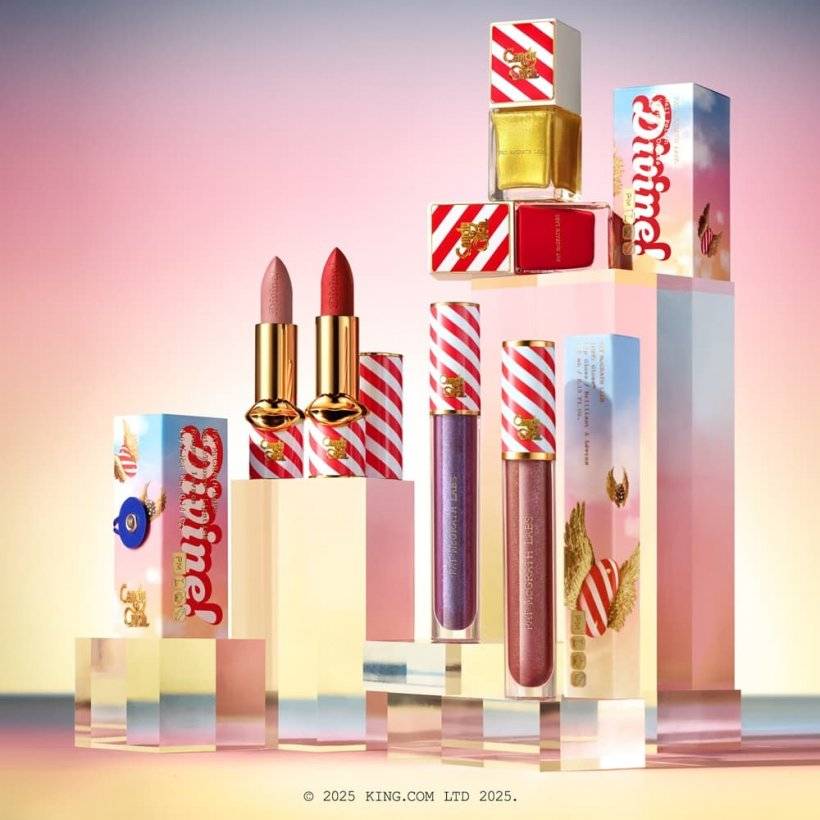 A picture of bejewelled cosmetic packaging with red and gold stripes